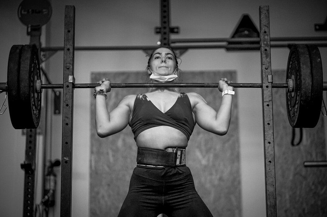 Studio portrait of a European woman trainer smiling